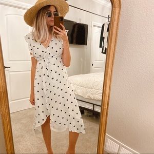 White and navy polka dot wrap dress